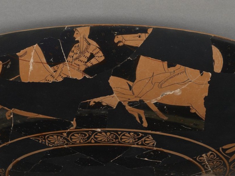 This Greek cup, dating from around 510 B.C., depicts an Amazon warrior on a horse. Scholars suggest wording on the vase names the woman Worthy of Armor in ancient Circassian.